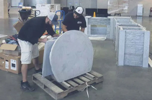 MarvelCrete precast concrete outdoor kitchen components being handled before installation